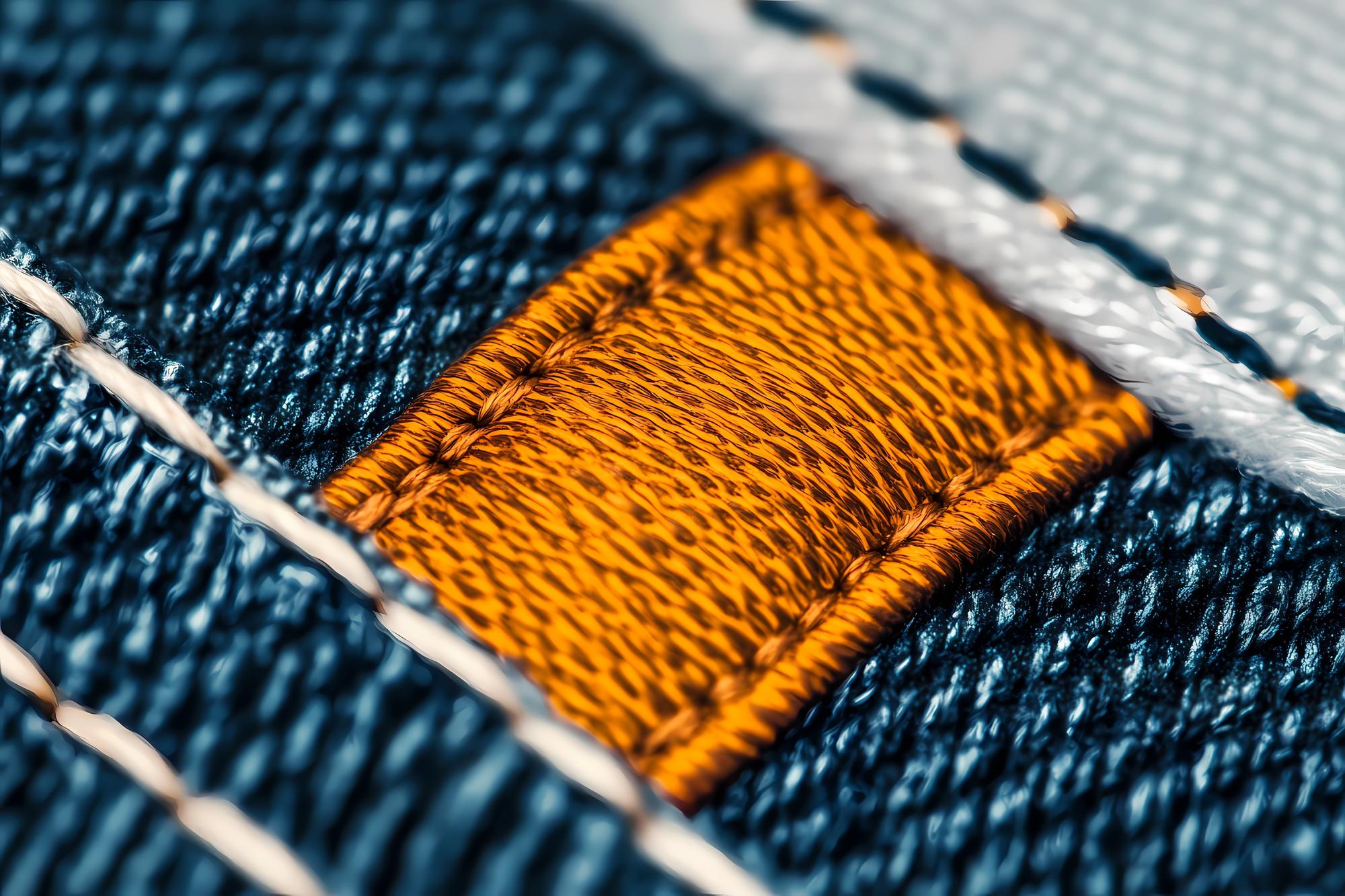 Close-up of embroidered badge on denim